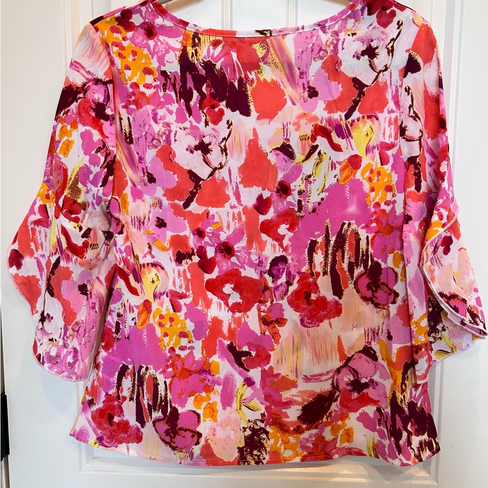 Bright fun flowy top. Size small. New never worn